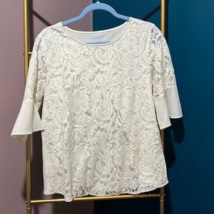 White blouse with lace detail and bell sleeves
